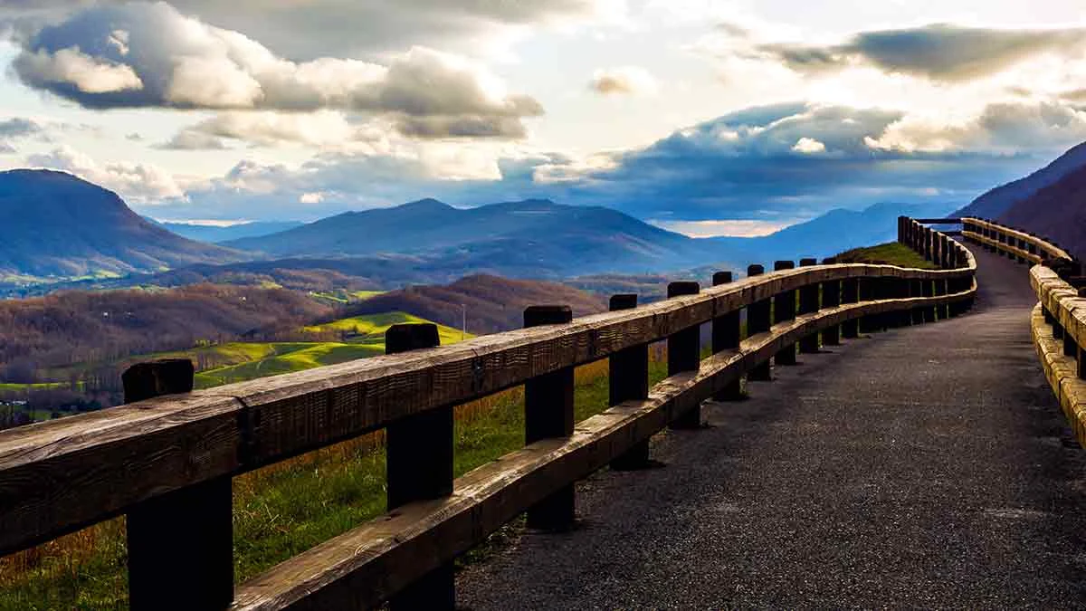 Paved overlook path and rustic wooden fence at Powell Valley Overlook above the Blue Ridge Mountains, Southwest Virginia