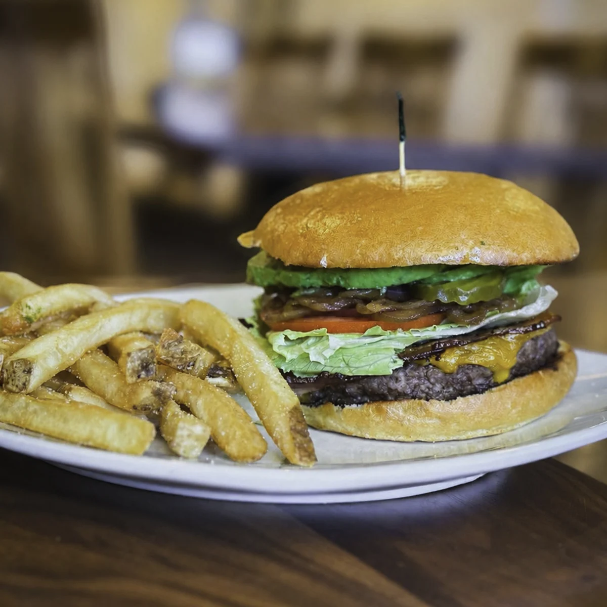 Bacon cheeseburger with avocado and fries served at The Heritage Table, a scratch-kitchen restaurant in Nickelsville, Virginia.