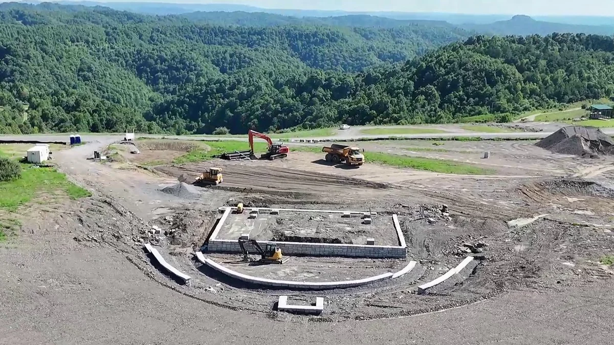Aerial view of the Southern Gap Amphitheater under construction on a reclaimed mountaintop in Buchanan County, Virginia.